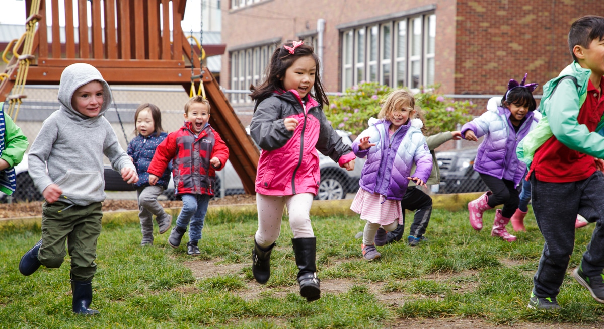 Image of children playing outside at Listen and Talk.