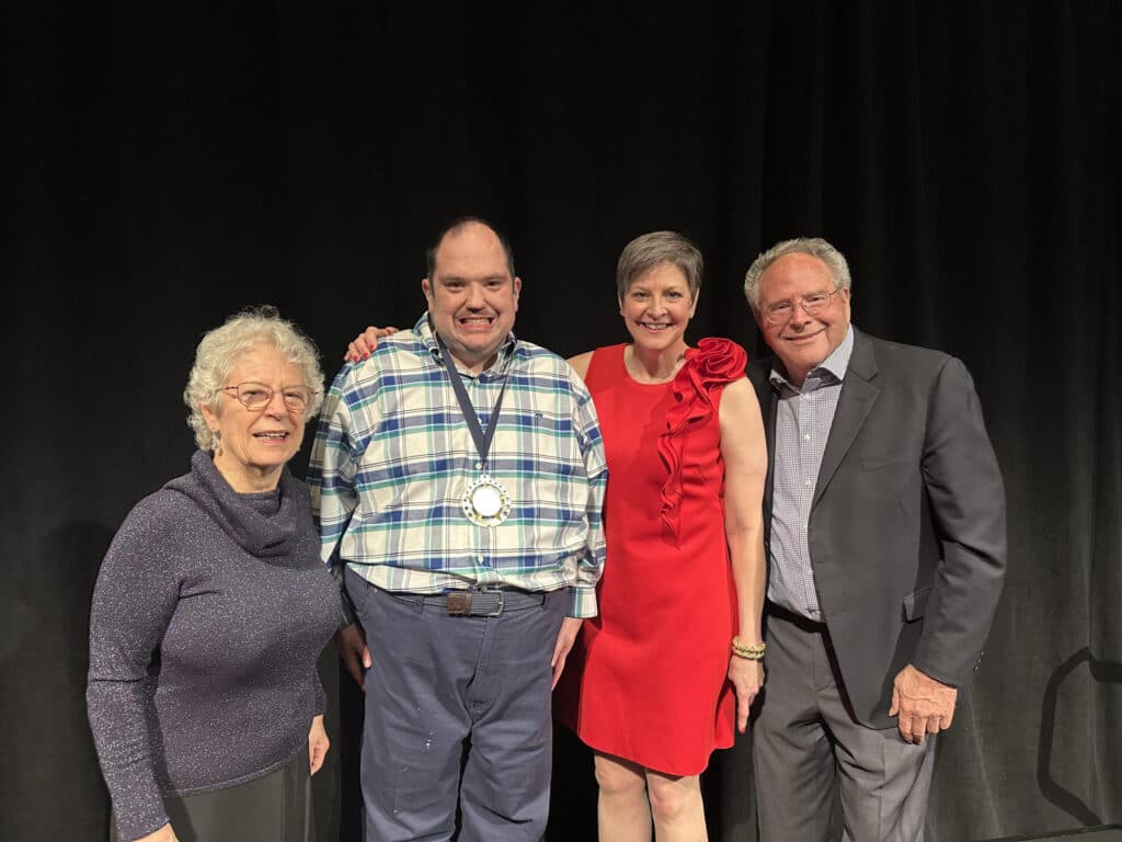 Preston Dwoskin receives the Mike and Sharon Hunter Life without Limits Award. Left to right: Sharon Hunter, Preston Dwoskin, Maura Berndsen, Mike Hunter.
