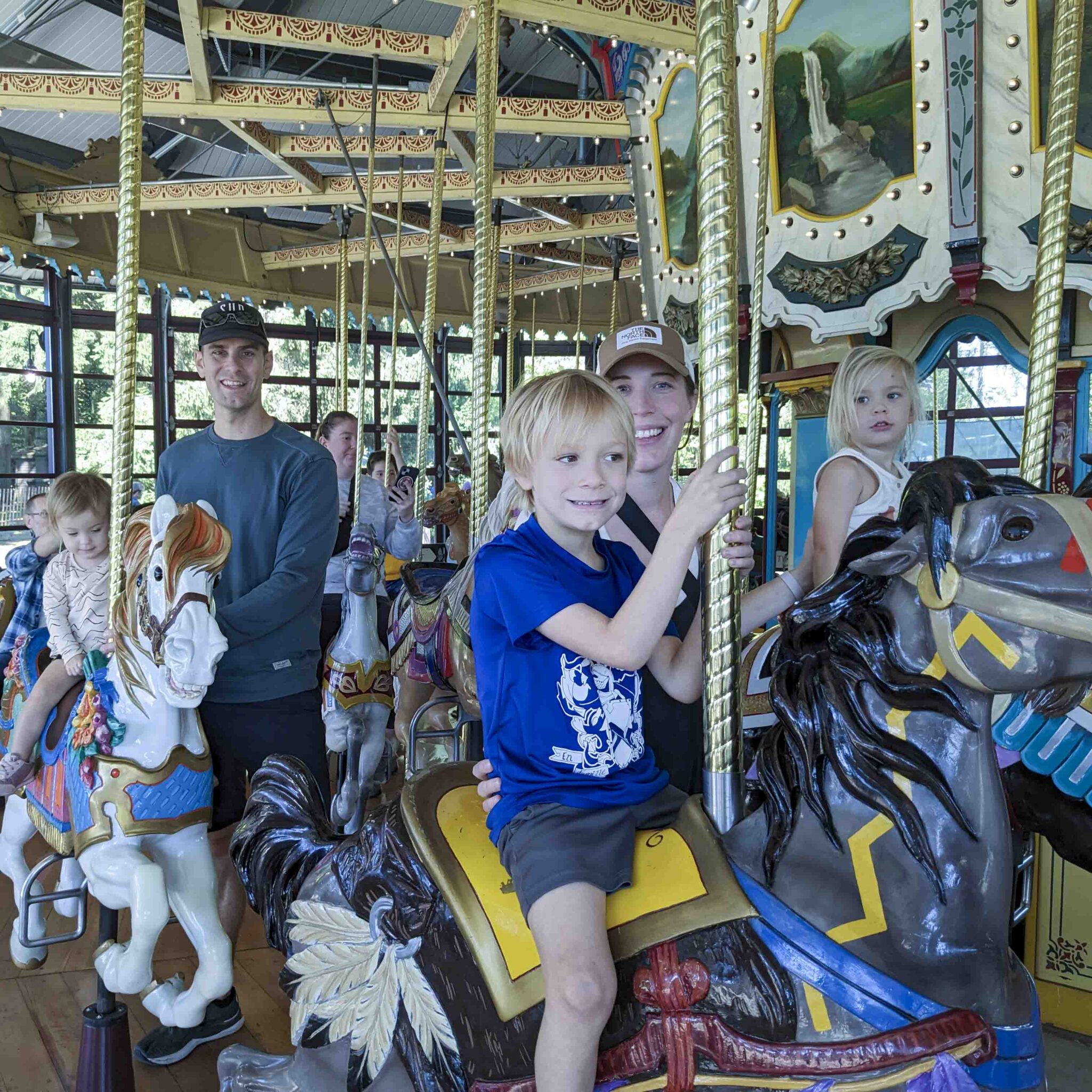 A family rides on the carousel